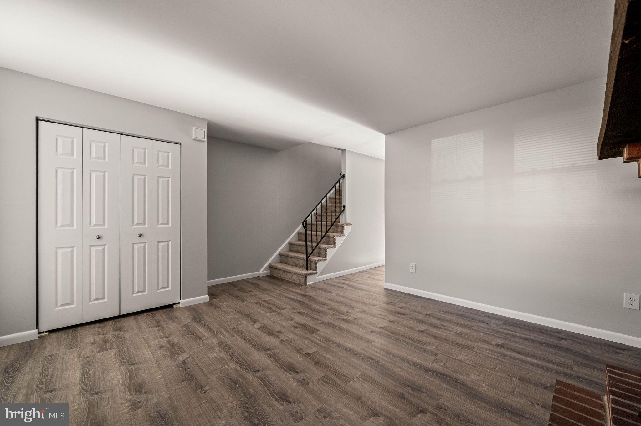 2404 Walnut Ridge Drive Pottstown, PA 19464 - Photo 5 of 24 a view of an empty room with wooden floor