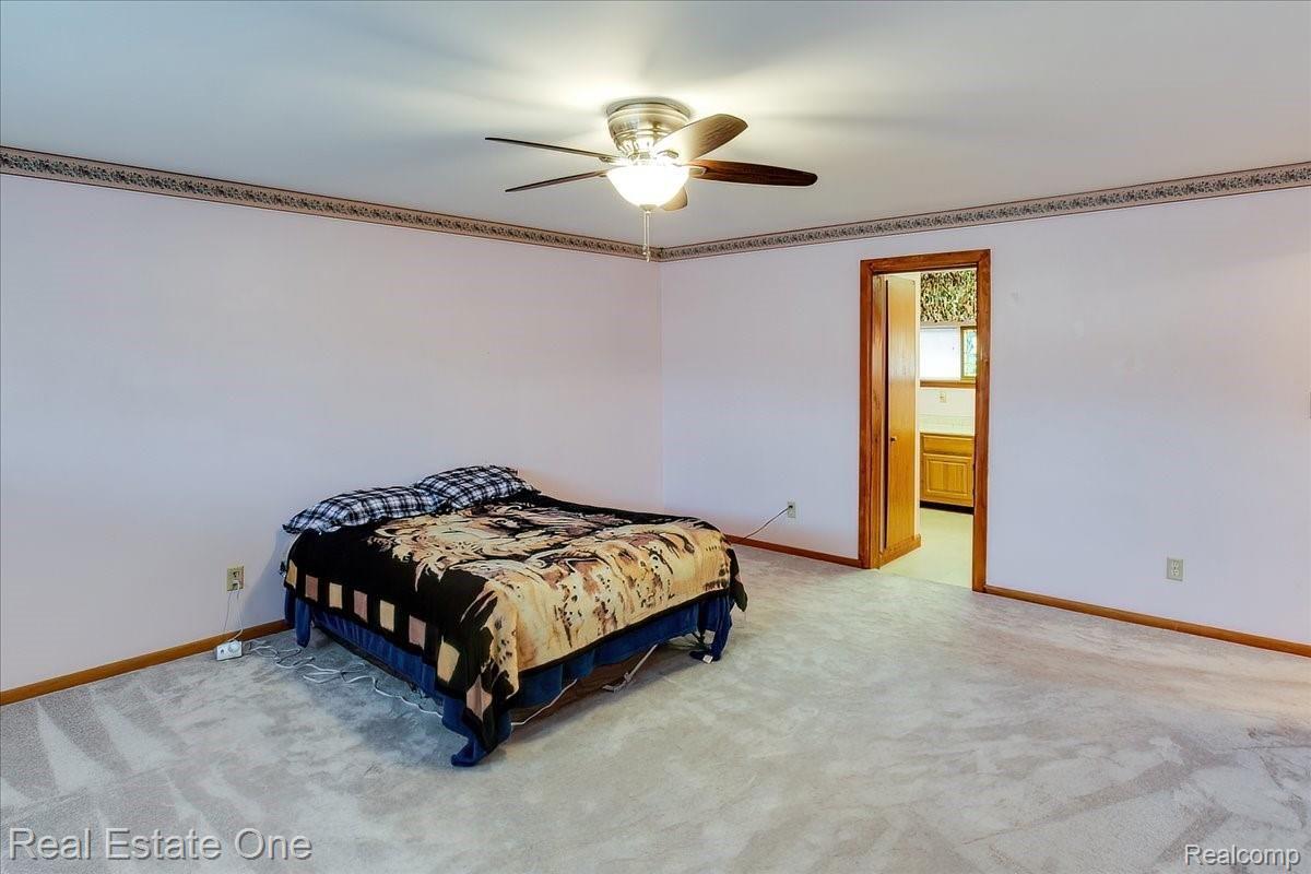 1730 Morley Avenue Rochester, MI 48307 - Photo 17 of 41 Primary bedroom (hardwood flooring under the carpeting)