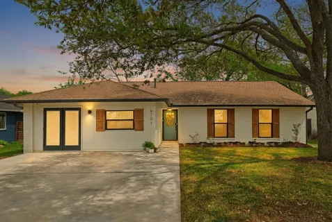 a front view of a house with yard