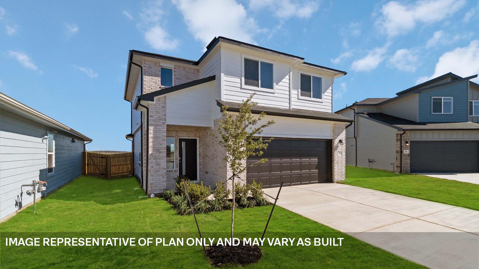 424 Mountain Pea Road Kyle, TX 78640 - Photo 4 of 25 a front view of a house with a garden and yard