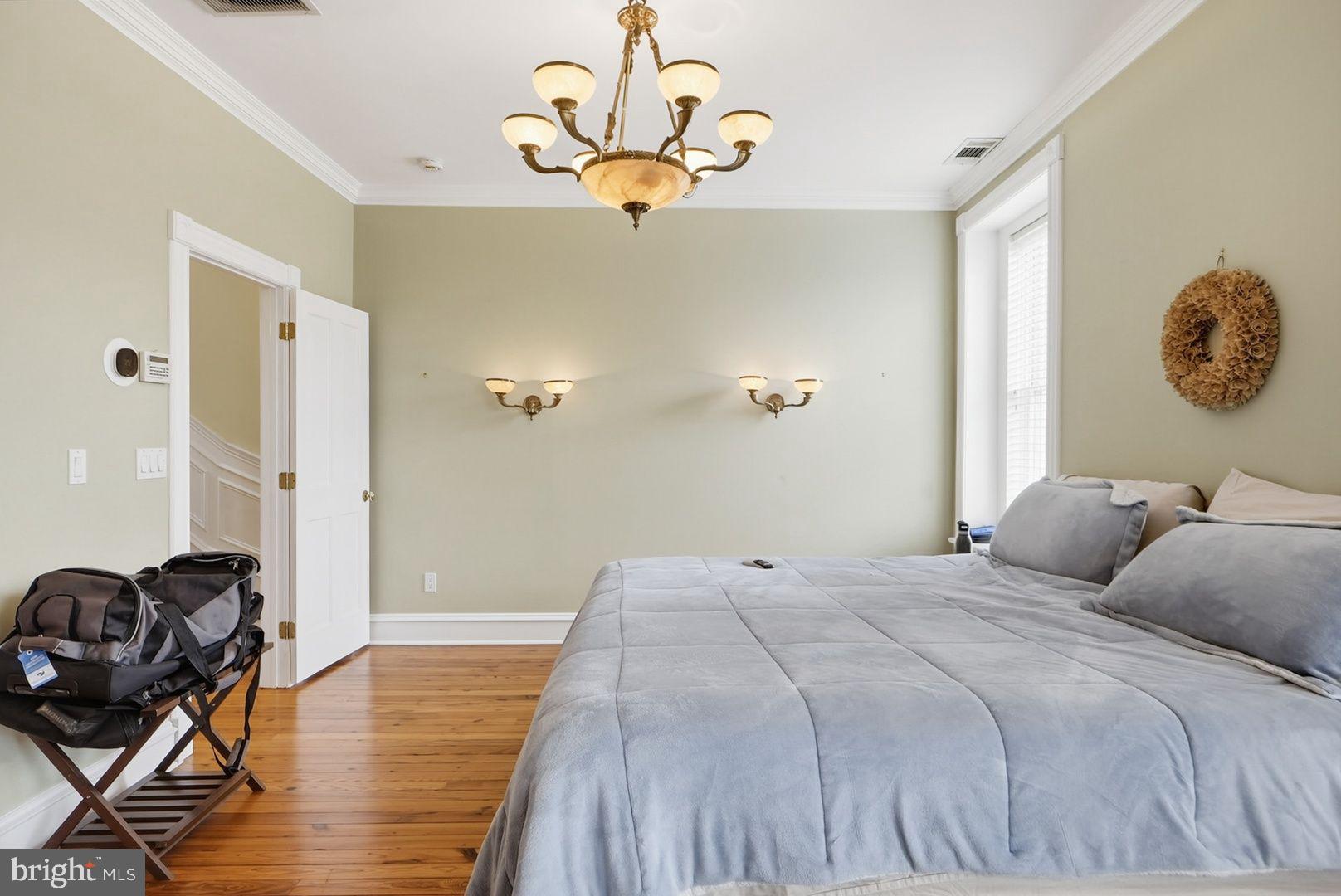 949 S Street Northwest Washington, DC 20001 - Photo 13 of 42 a bedroom with a bed and wooden floor