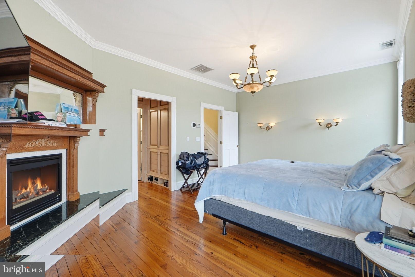 949 S Street Northwest Washington, DC 20001 - Photo 15 of 42 a bedroom with a bed and a fireplace