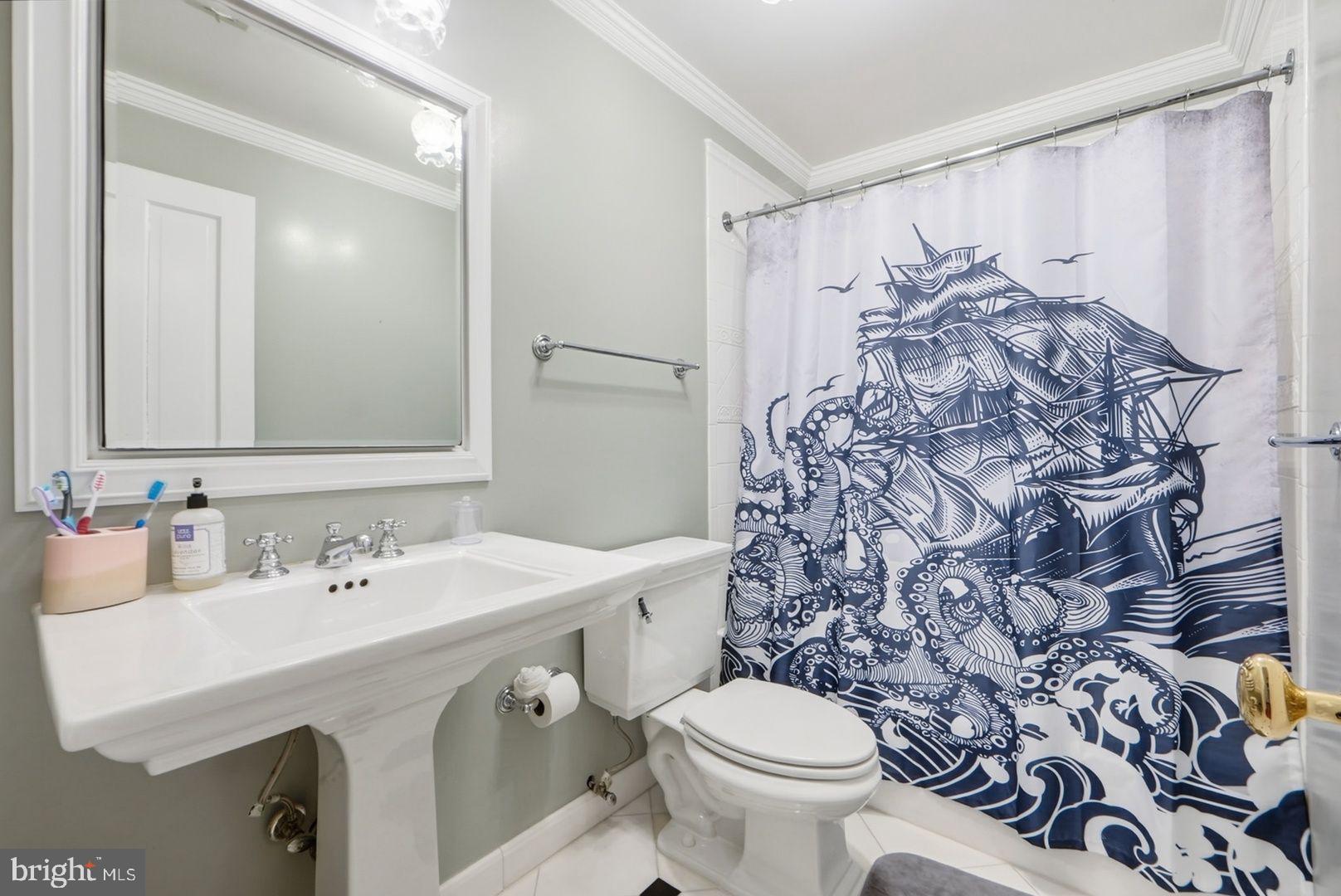 949 S Street Northwest Washington, DC 20001 - Photo 22 of 42 a bathroom with a sink toilet and shower