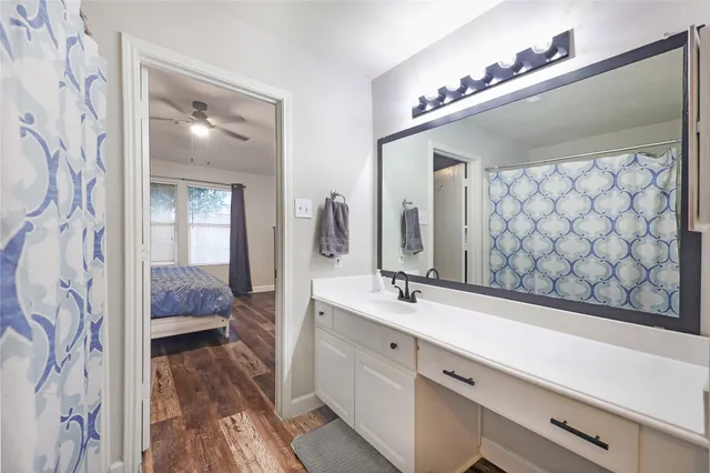 a en suite bathroom with a sink and a mirror
