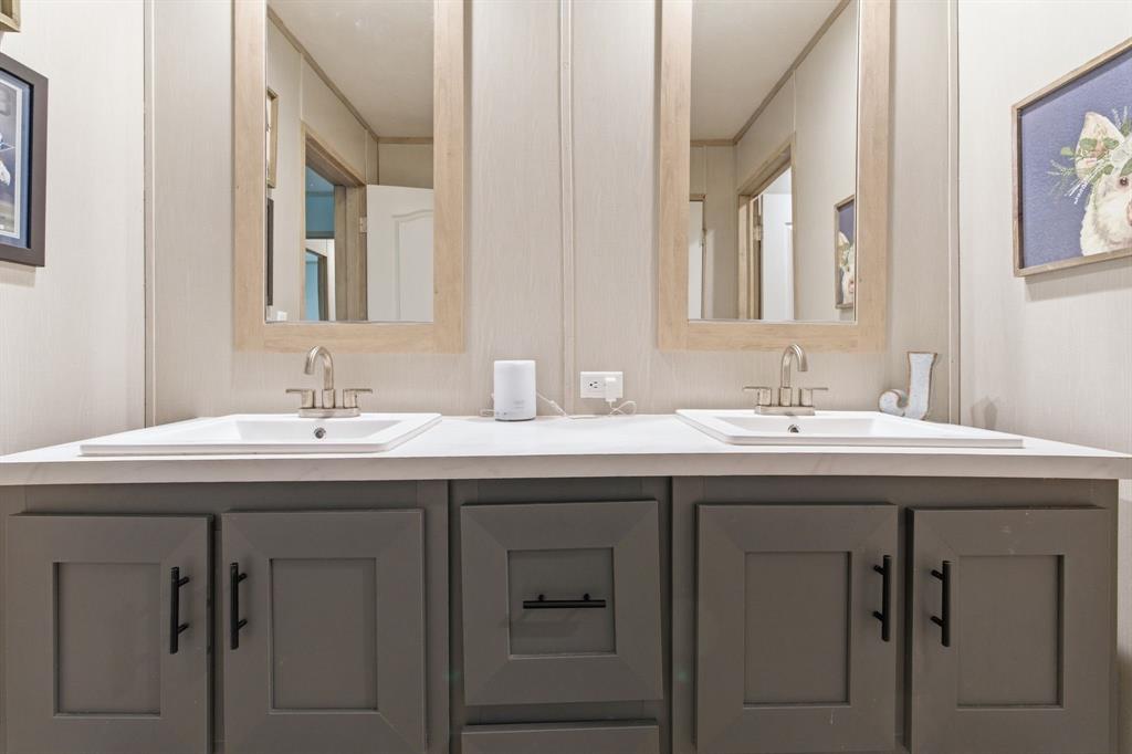 8792 Highway 67 Saltillo, TX 75478 - Photo 32 of 40 a bathroom with a sink and a mirror