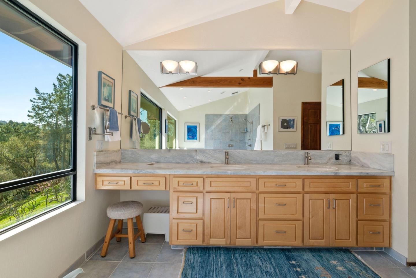 5310 Freedom Boulevard Aptos, CA 95003 - Photo 53 of 100 a bathroom with a granite countertop sink and a large mirror