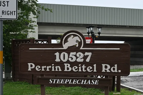 a front view of a house with sign board
