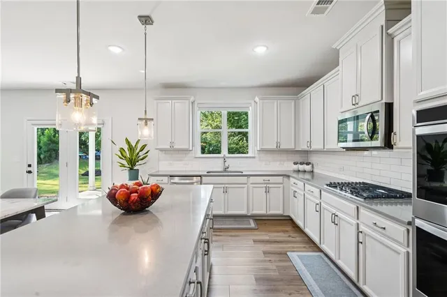 a kitchen with sink and window