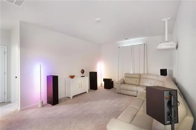 a living room with furniture and white walls