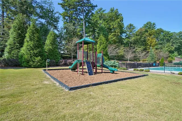 a view of a swimming pool with an outdoor space and seating area