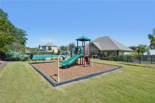 a view of a swimming pool with a patio