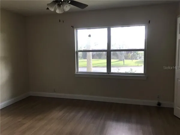 a view of an empty room with a window