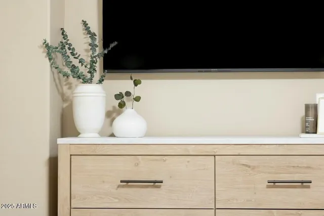 a close view of bathroom with a potted plant