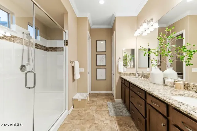 a bathroom with a granite countertop shower sink and mirror