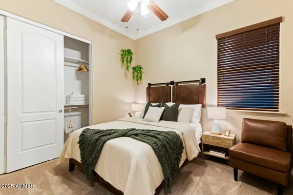 a bedroom with a bed and a couch