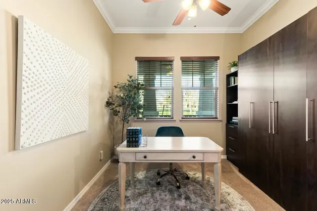a dining room with a table and chairs