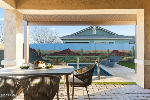 a view of swimming pool with lounge chair