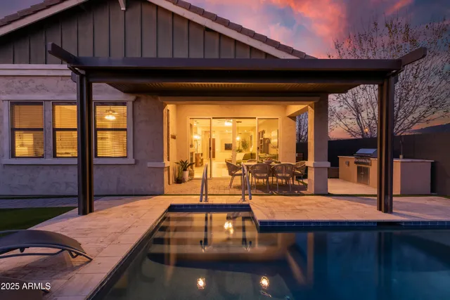 a view of a patio with wooden floor and iron stairs