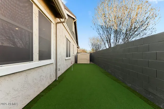 a backyard of a house with lots of green space