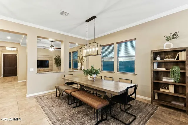 a living room with furniture a rug and a chandelier