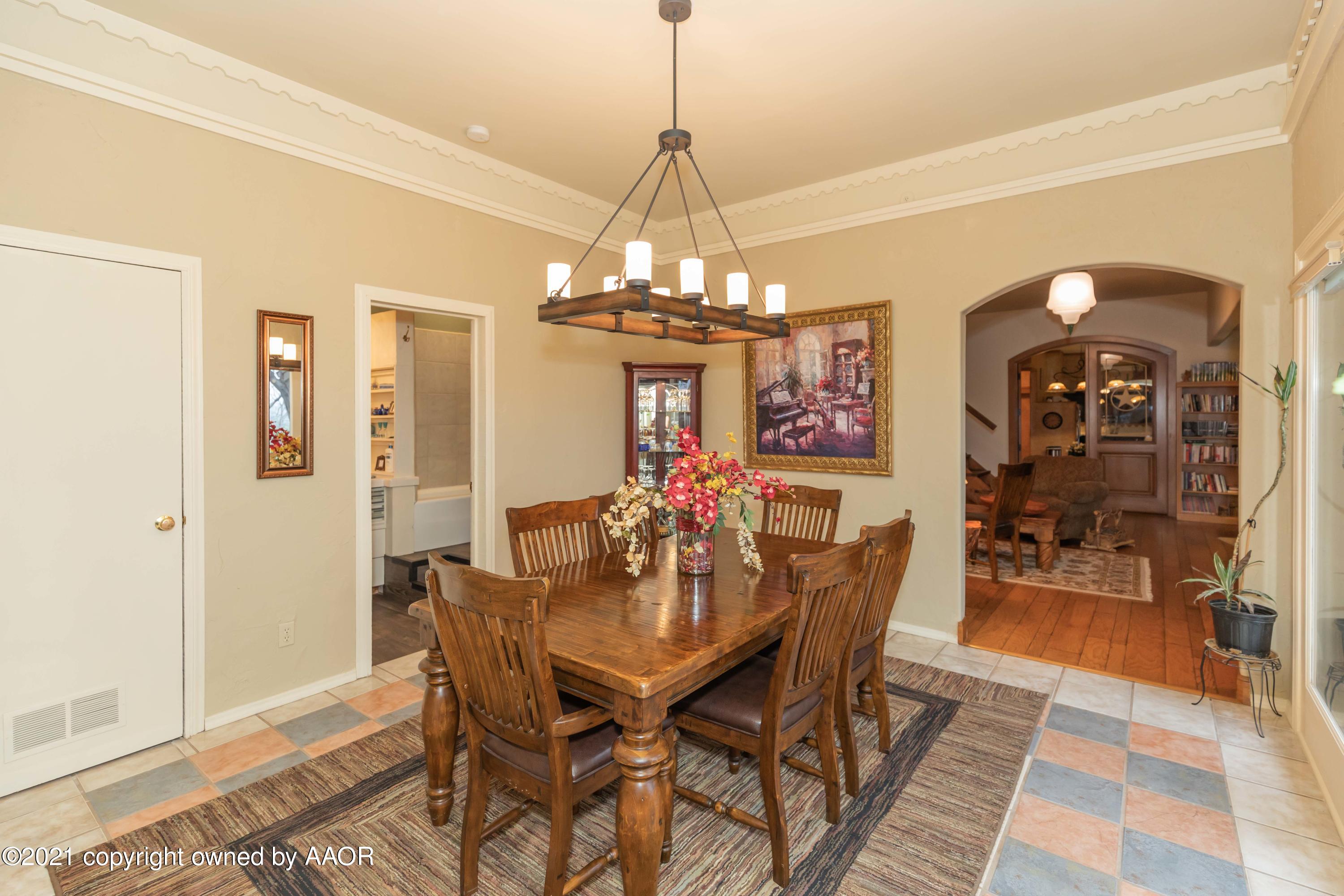 808 Craft Center Road Amarillo, TX 79118 - Photo 19 of 77 a view of a dining room with furniture and wooden floor