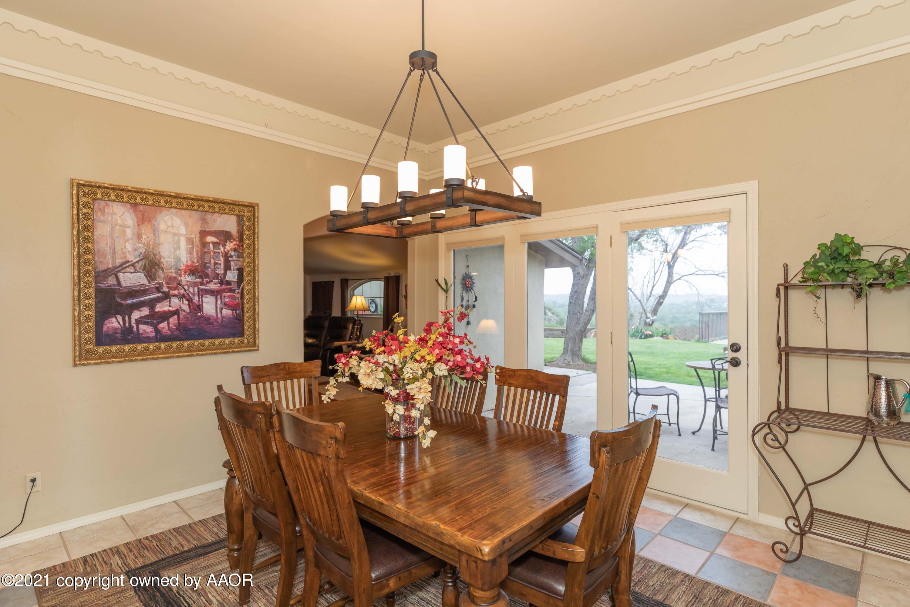 808 Craft Center Road Amarillo, TX 79118 - Photo 20 of 77 a view of a dining room with furniture window and outside view