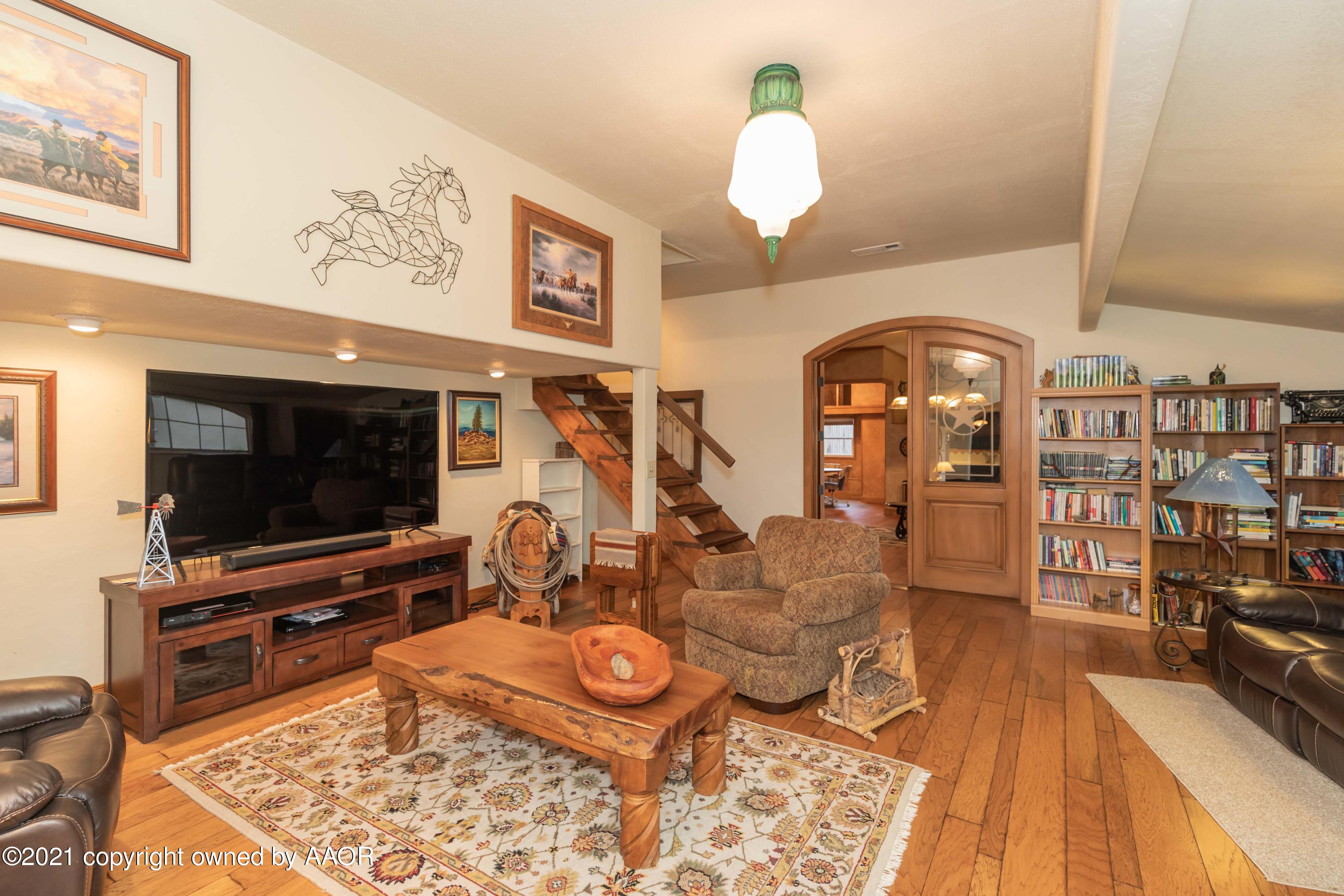 808 Craft Center Road Amarillo, TX 79118 - Photo 22 of 77 a living room with furniture and a flat screen tv
