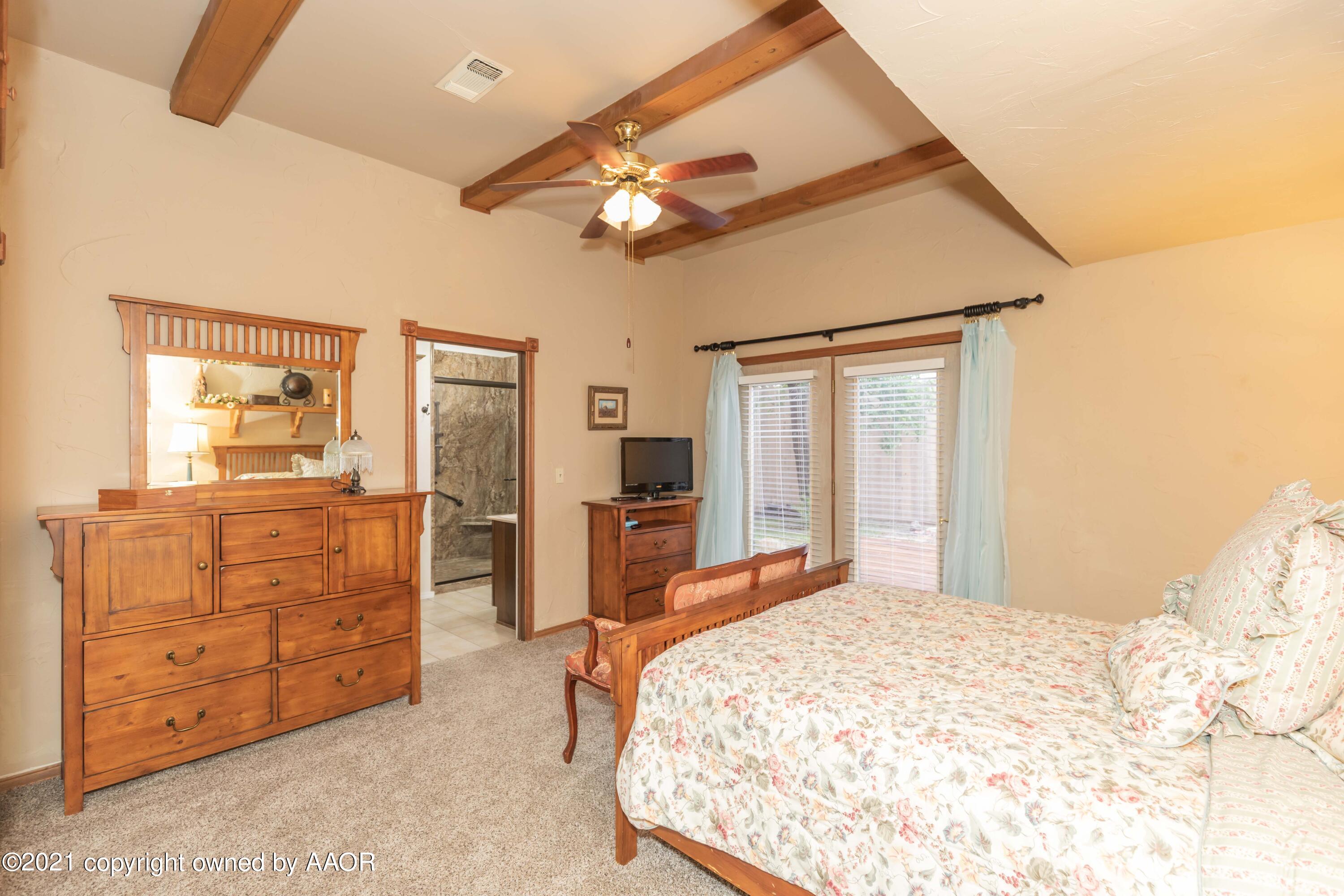 808 Craft Center Road Amarillo, TX 79118 - Photo 26 of 77 a bedroom with a bed and a dresser