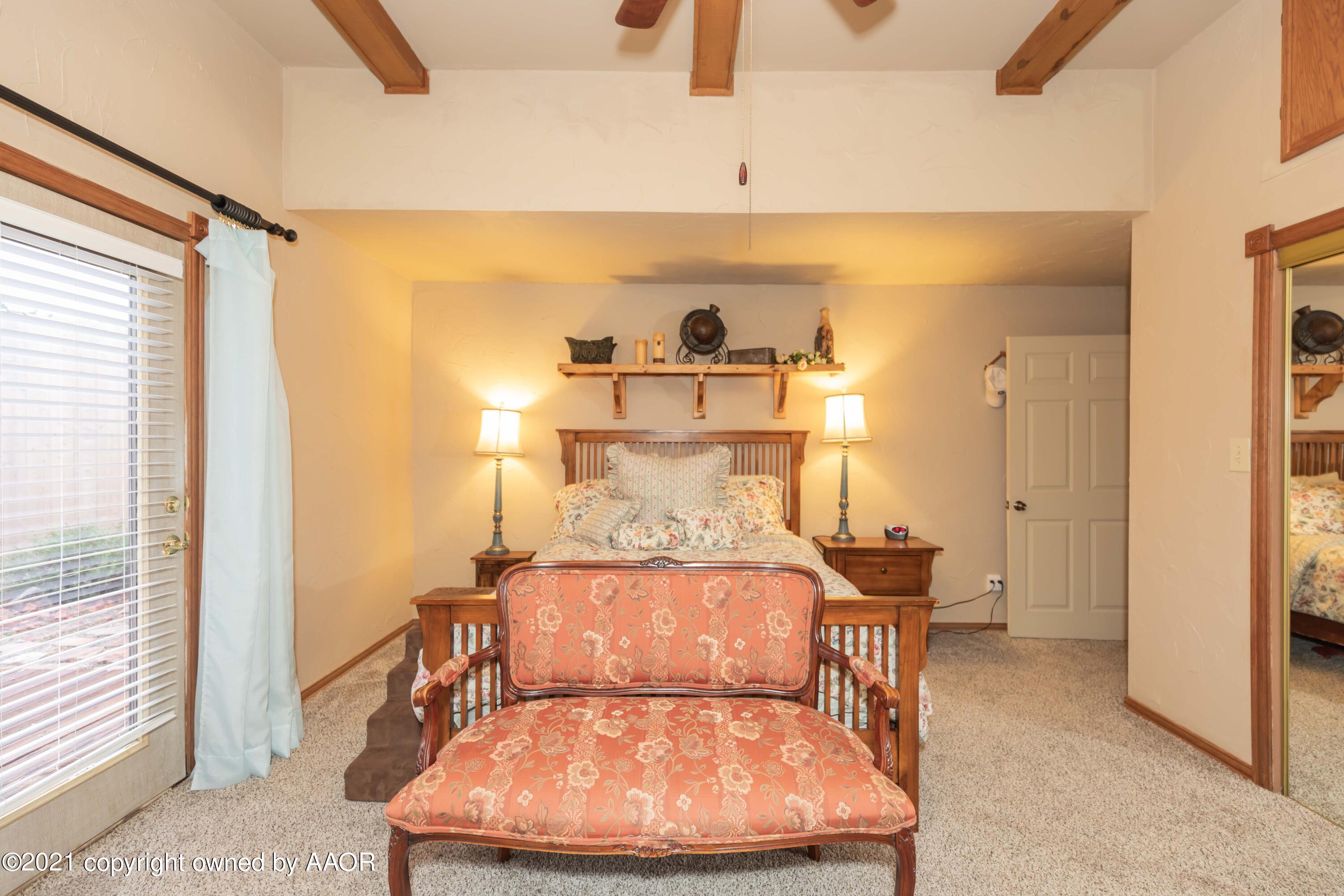 808 Craft Center Road Amarillo, TX 79118 - Photo 28 of 77 a bed room with a bed and a night stand