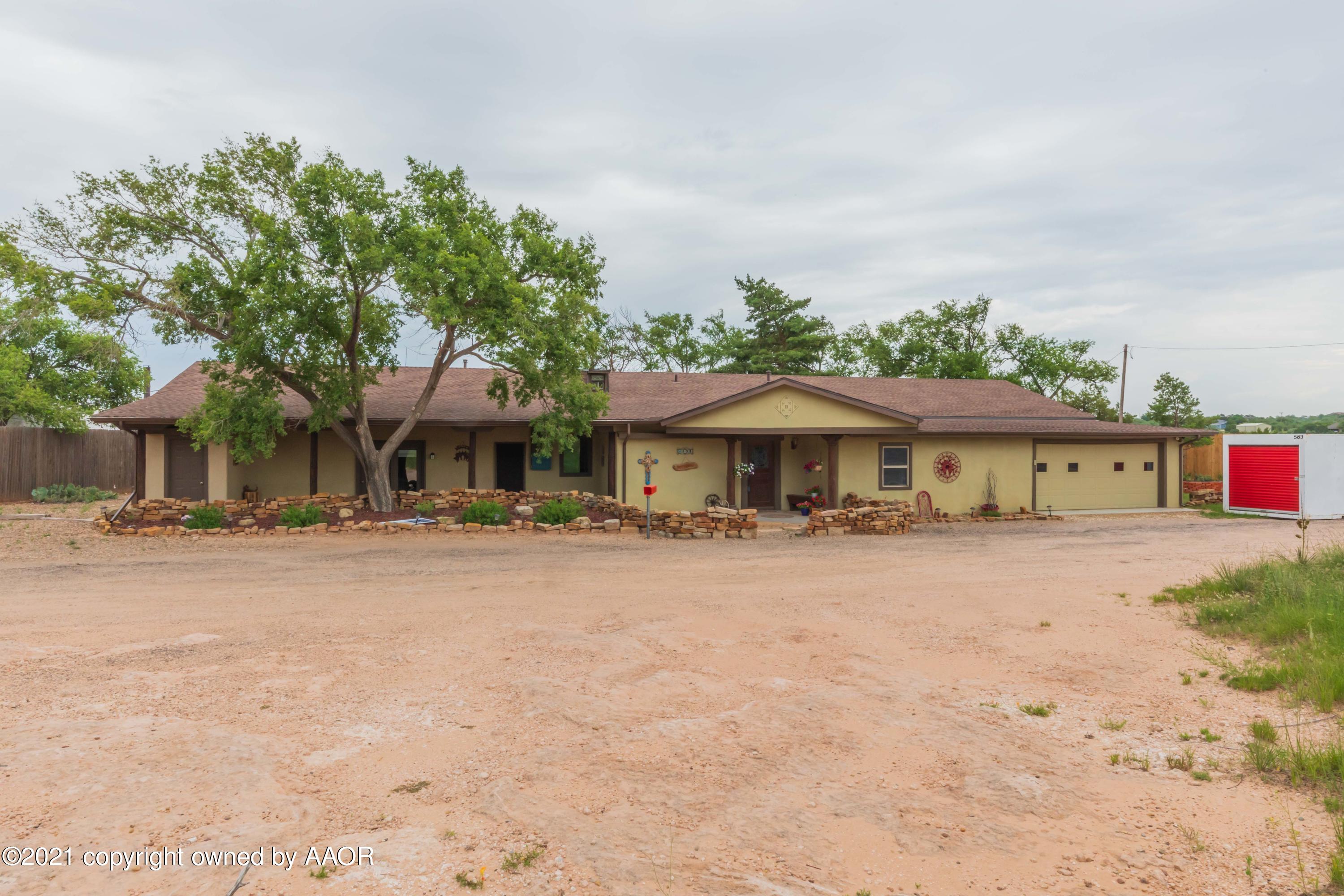 808 Craft Center Road Amarillo, TX 79118 - Photo 3 of 77 a front view of a house with a yard and a garage