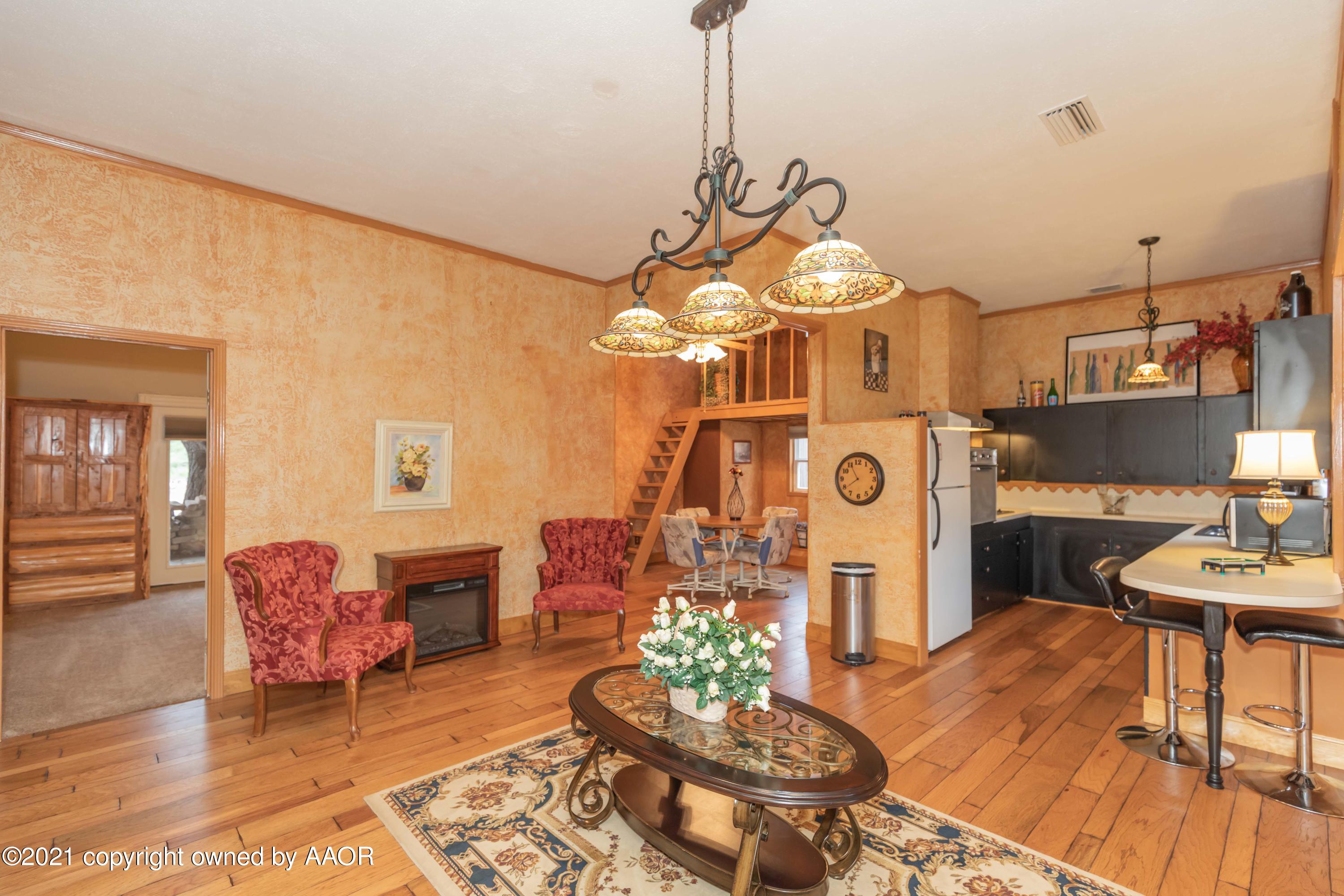 808 Craft Center Road Amarillo, TX 79118 - Photo 50 of 77 a living room with furniture and a chandelier