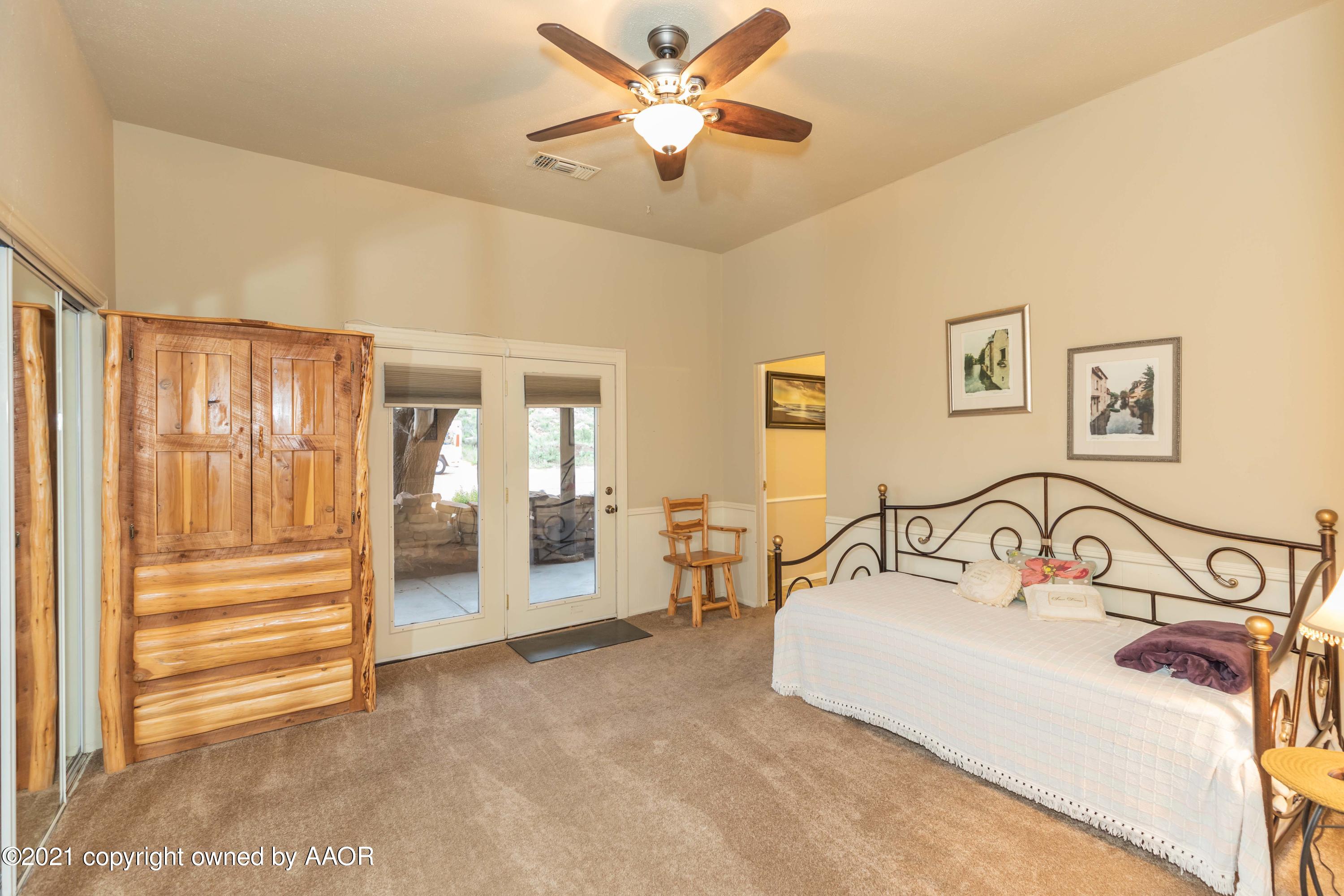 808 Craft Center Road Amarillo, TX 79118 - Photo 55 of 77 a bedroom with furniture and a large window