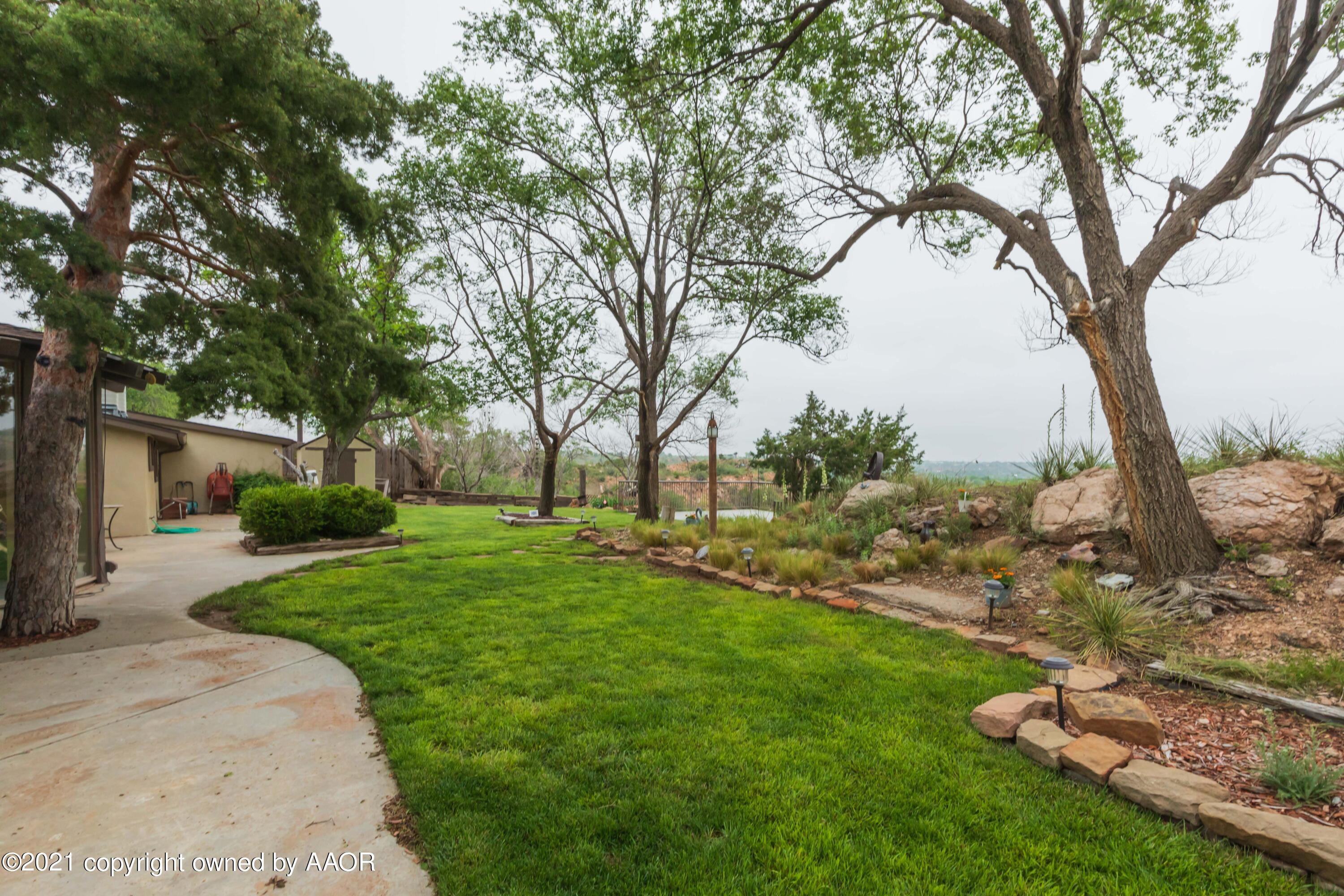 808 Craft Center Road Amarillo, TX 79118 - Photo 65 of 77 a view of a backyard with large trees