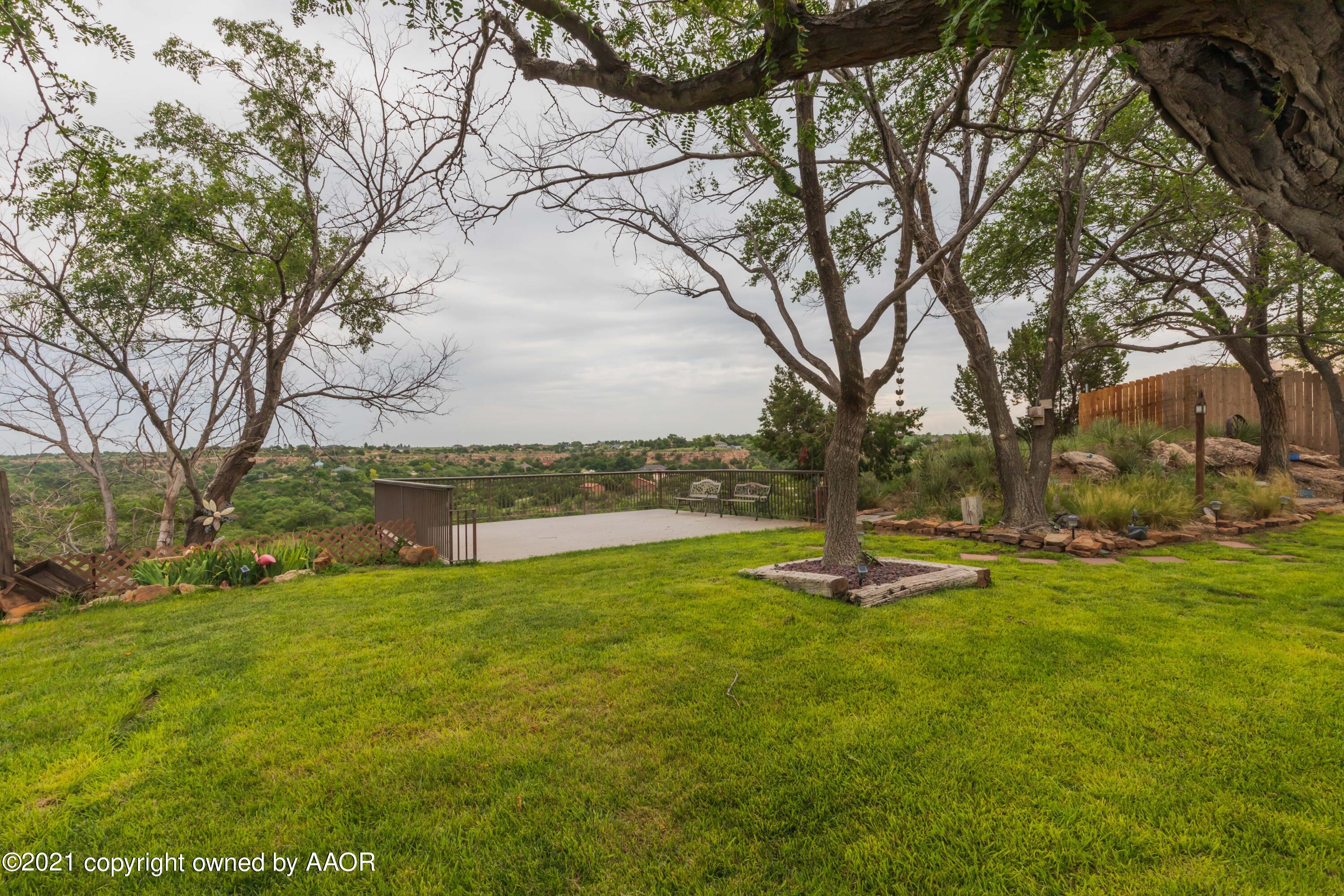 808 Craft Center Road Amarillo, TX 79118 - Photo 67 of 77 a backyard of a house with lots of green space and fountain