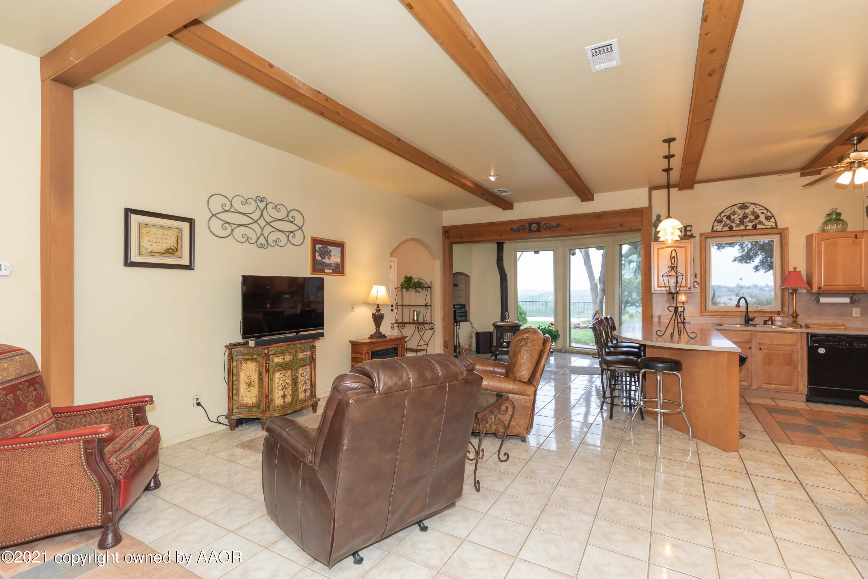 808 Craft Center Road Amarillo, TX 79118 - Photo 10 of 77 a living room with furniture and a flat screen tv