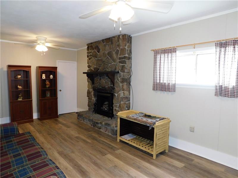 113 Singer Way Ligonier, PA 15658 - Photo 8 of 19 Stay warm on cold winter nights by this beautiful stone fireplace