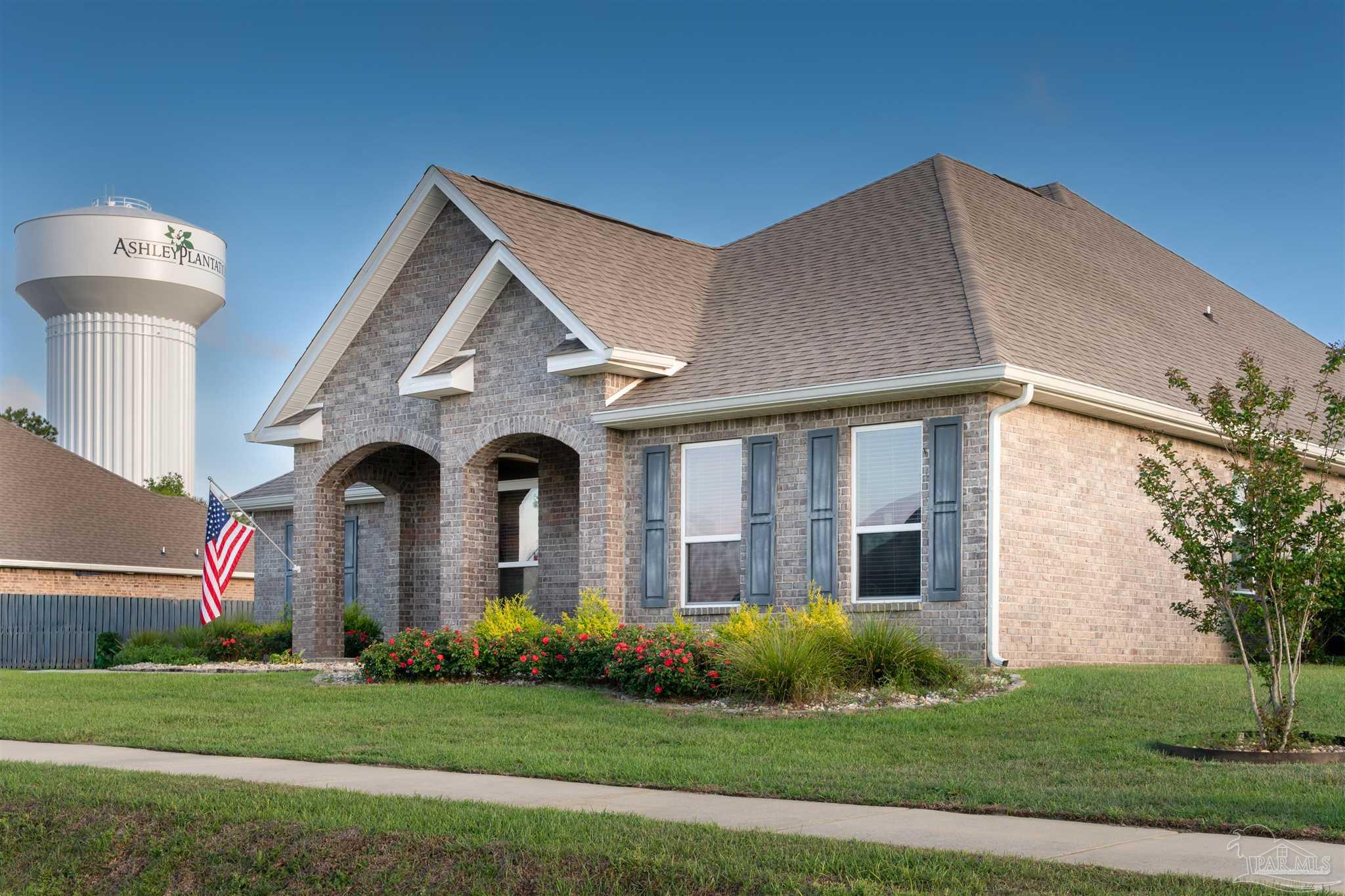 2759 Gemstone Circle Pace, FL 32571 - Photo 1 of 36 a front view of a house with a yard