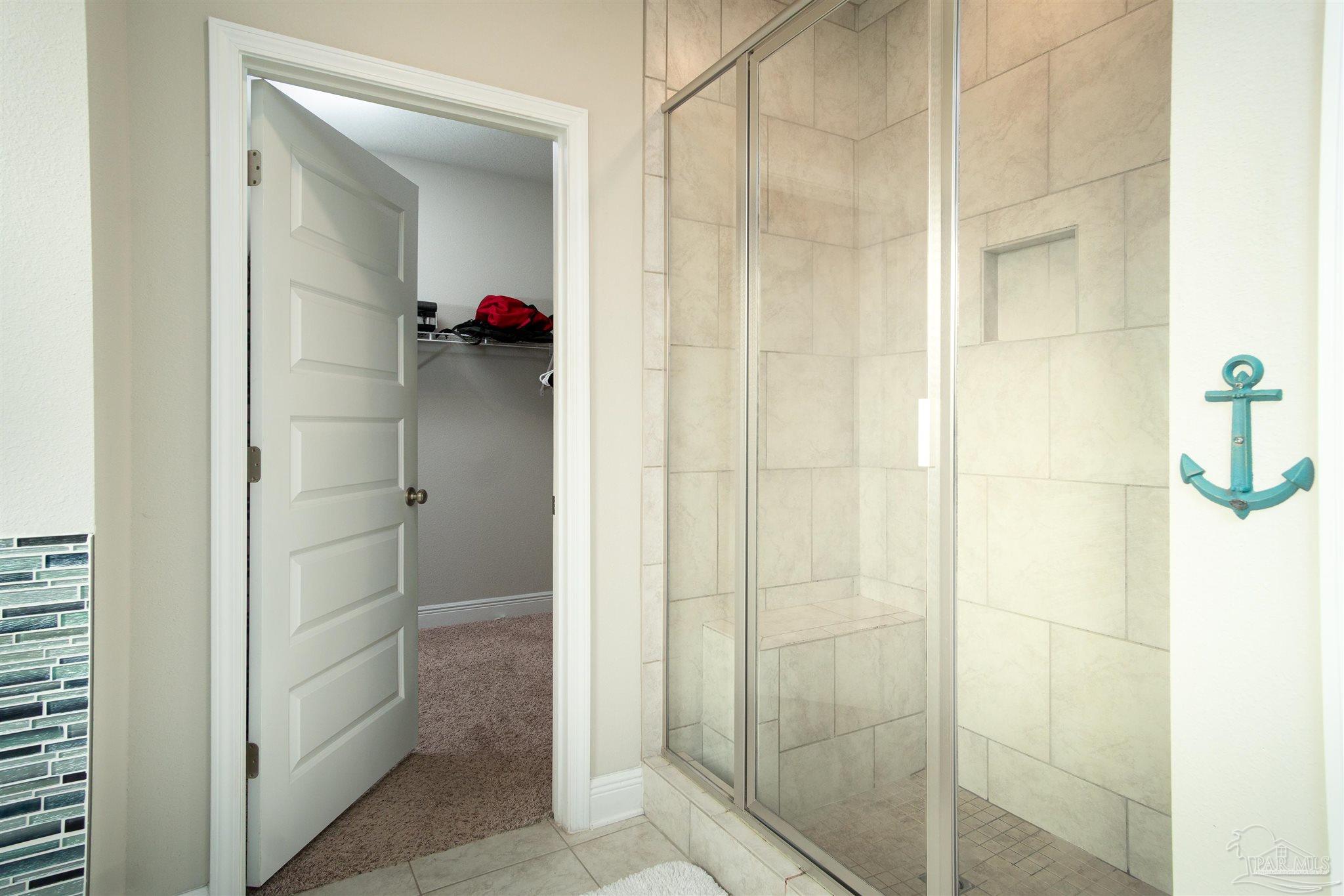 2759 Gemstone Circle Pace, FL 32571 - Photo 13 of 36 a bathroom that has a shower