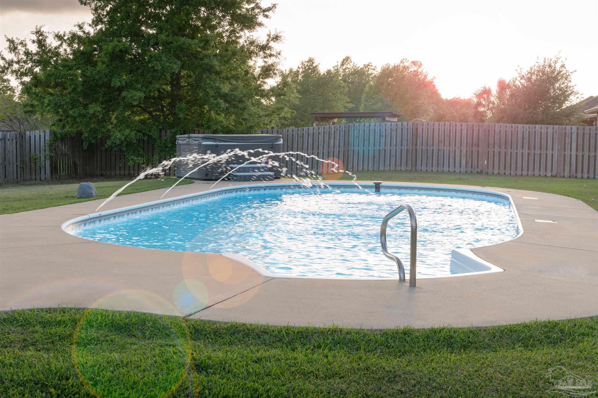 2759 Gemstone Circle Pace, FL 32571 - Photo 17 of 36 a view of a backyard with a trampoline