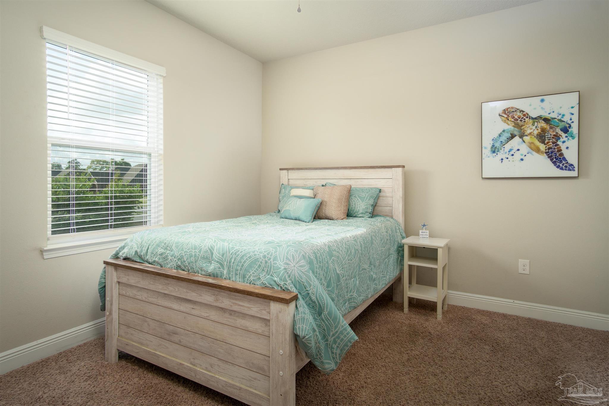 2759 Gemstone Circle Pace, FL 32571 - Photo 21 of 36 a bedroom with a bed and a window