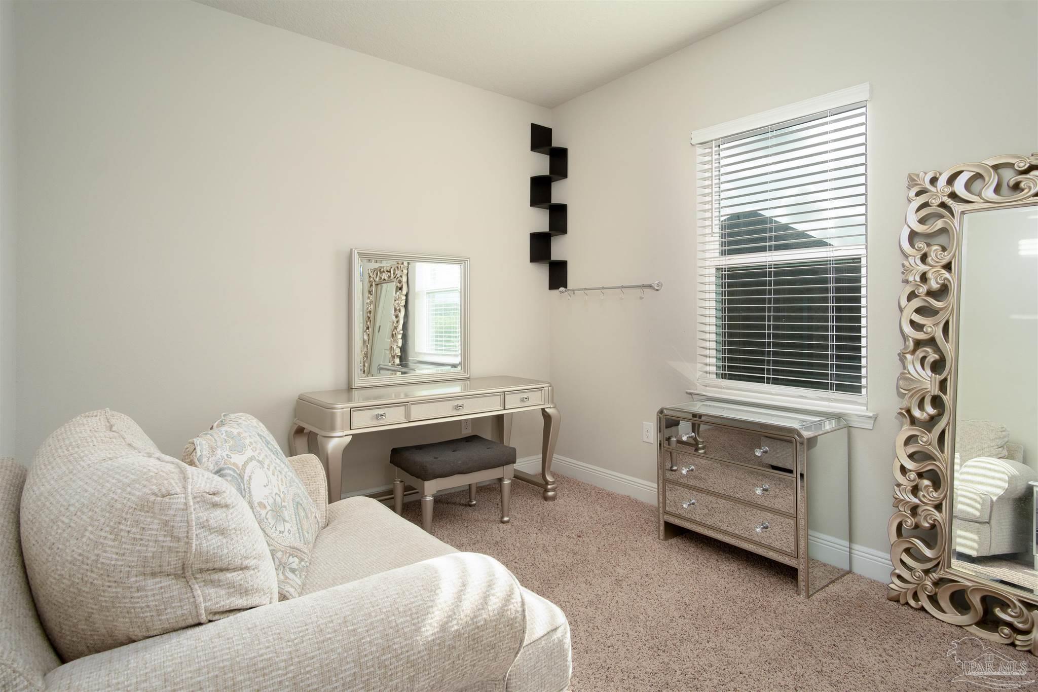 2759 Gemstone Circle Pace, FL 32571 - Photo 22 of 36 a living room with furniture and a window
