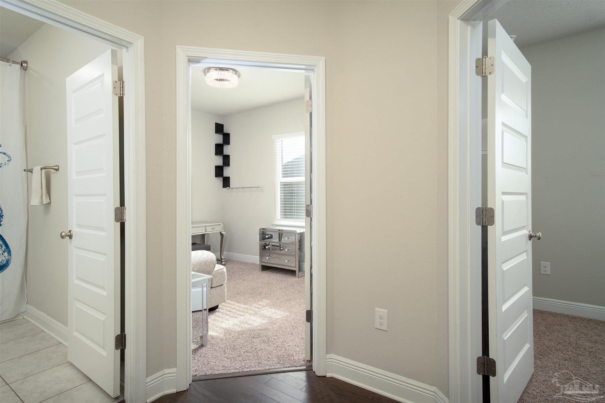 2759 Gemstone Circle Pace, FL 32571 - Photo 24 of 36 a bathroom with a glass door shower