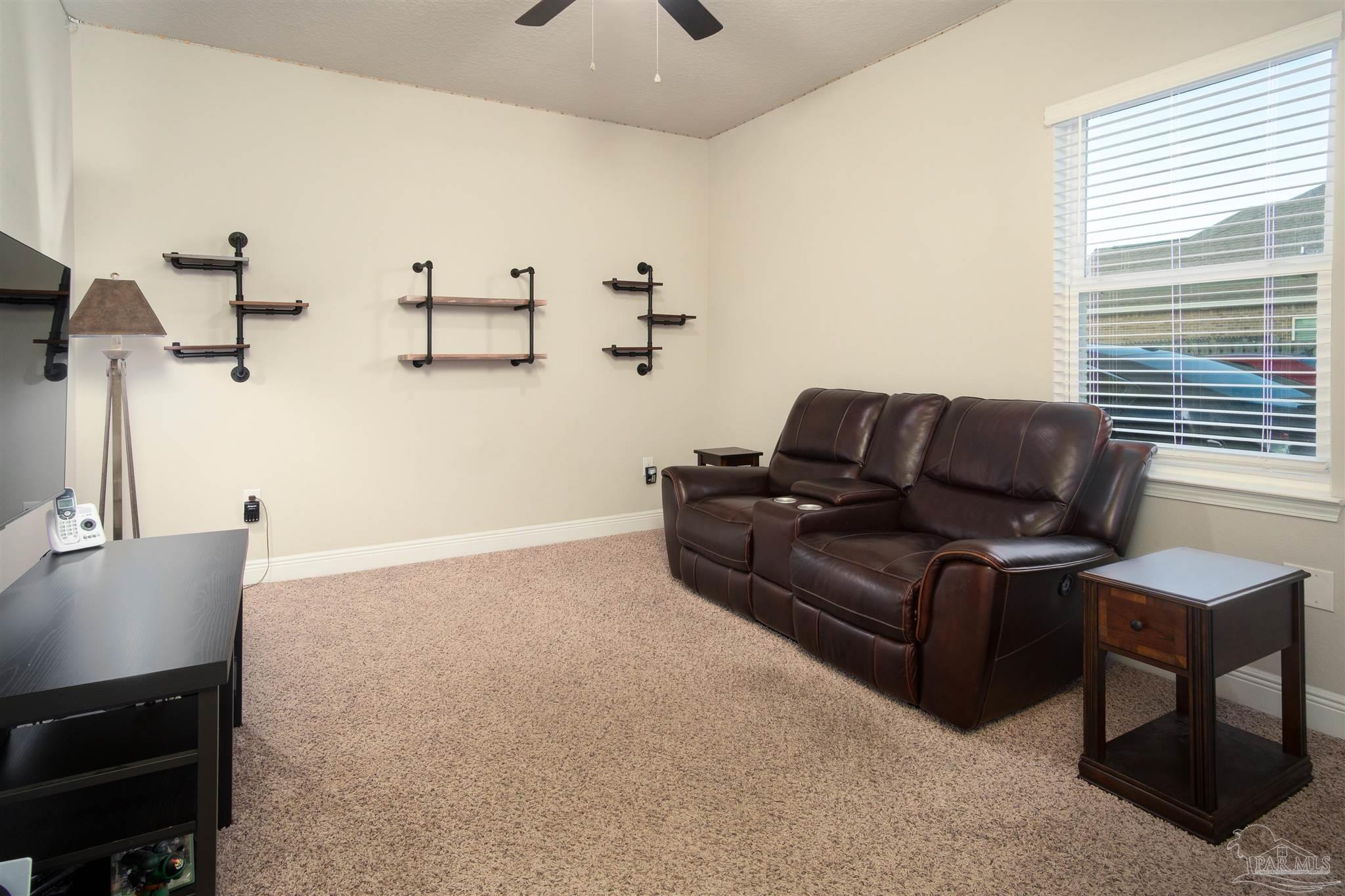 2759 Gemstone Circle Pace, FL 32571 - Photo 25 of 36 a living room with furniture