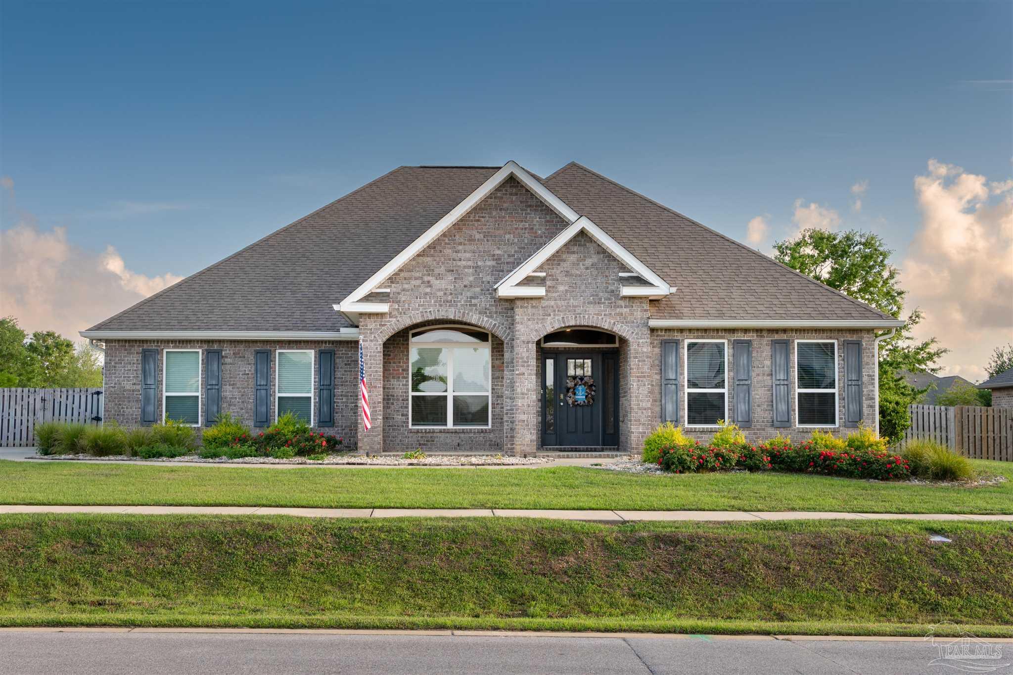 2759 Gemstone Circle Pace, FL 32571 - Photo 30 of 36 a front view of a house with a yard