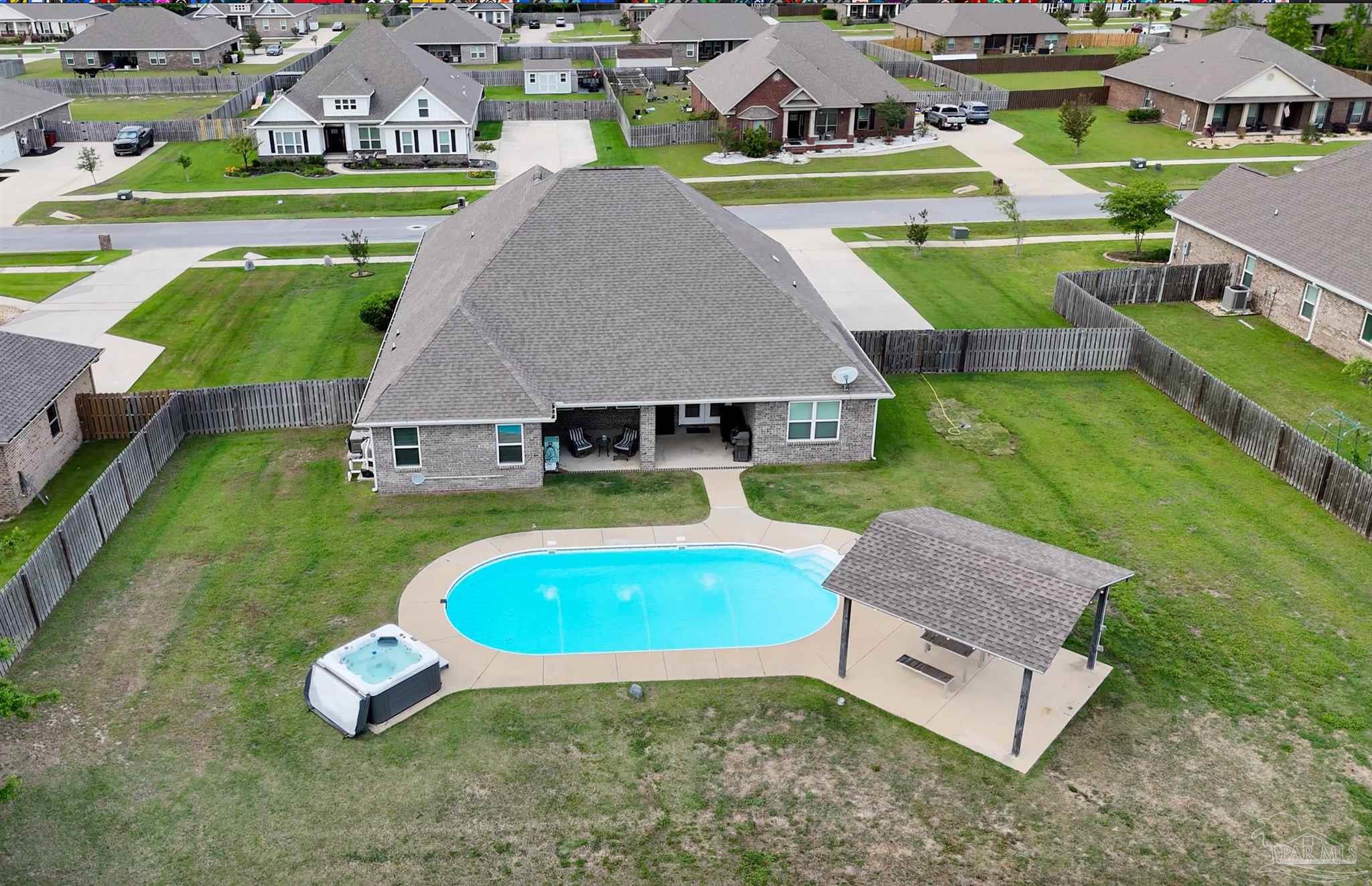 2759 Gemstone Circle Pace, FL 32571 - Photo 34 of 36 an aerial view of a house with swimming pool yard and outdoor seating