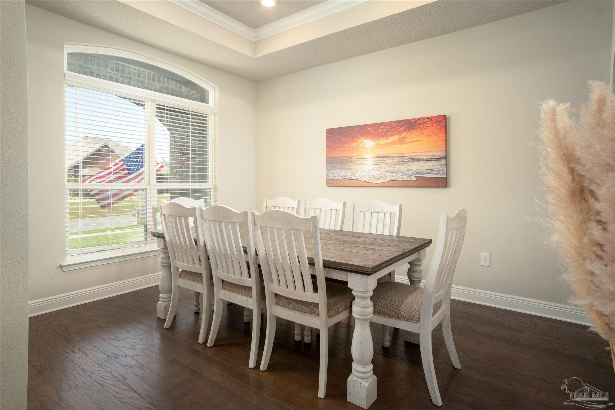 2759 Gemstone Circle Pace, FL 32571 - Photo 8 of 36 a view of a dining room with furniture window and wooden floor