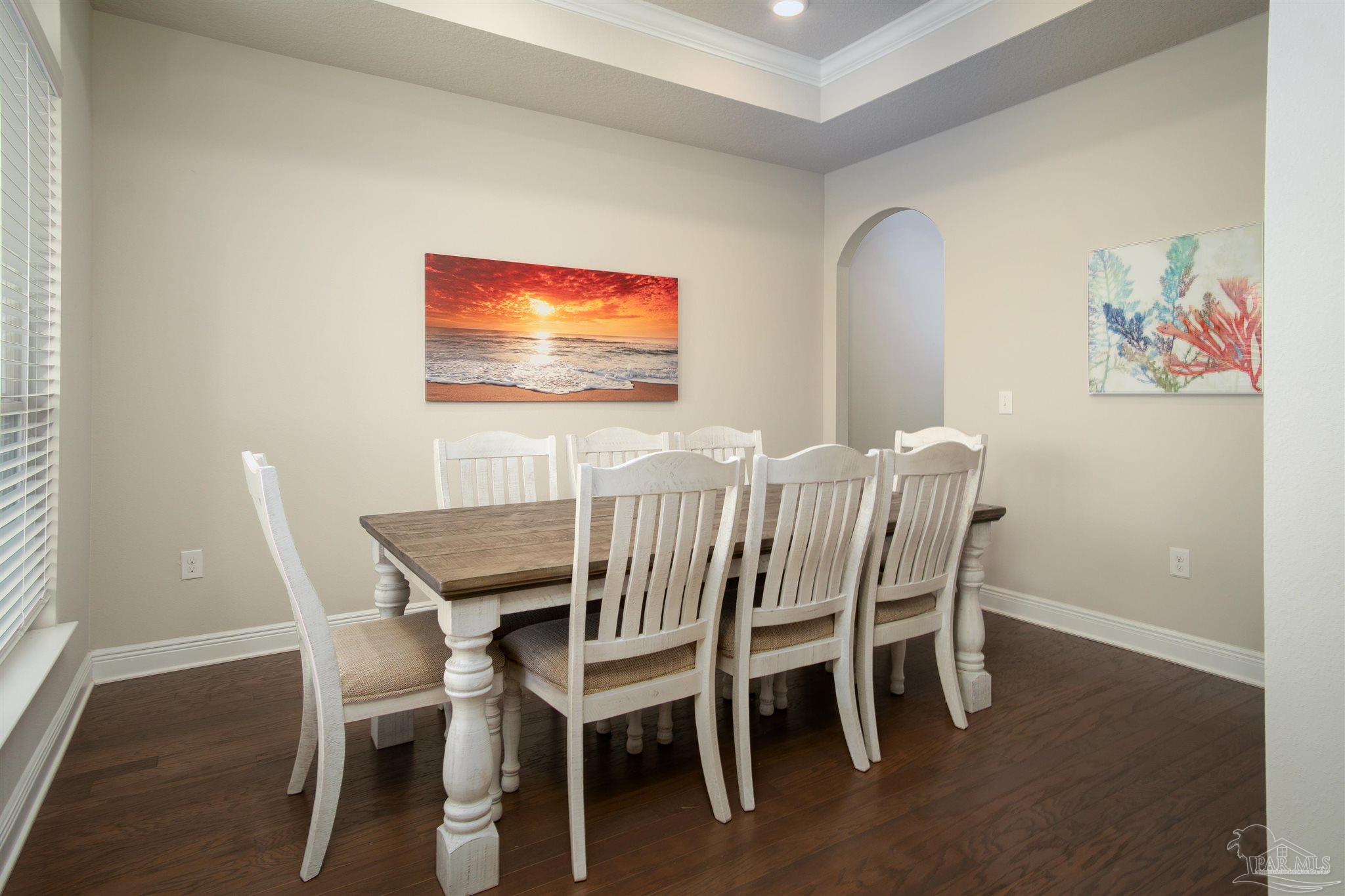 2759 Gemstone Circle Pace, FL 32571 - Photo 9 of 36 a view of a dining room with furniture and wooden floor