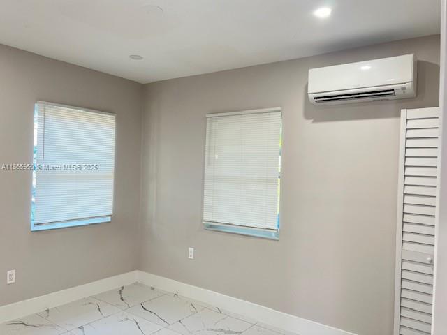 922 Northwest 2nd Street, Unit 4 Miami, FL 33128 - Photo 13 of 35 an empty room with a window
