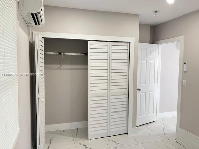922 Northwest 2nd Street, Unit 4 Miami, FL 33128 - Photo 18 of 35 a view of a hallway with closet area