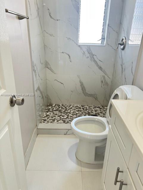 922 Northwest 2nd Street, Unit 4 Miami, FL 33128 - Photo 28 of 35 a bathroom with a sink a toilet and shower